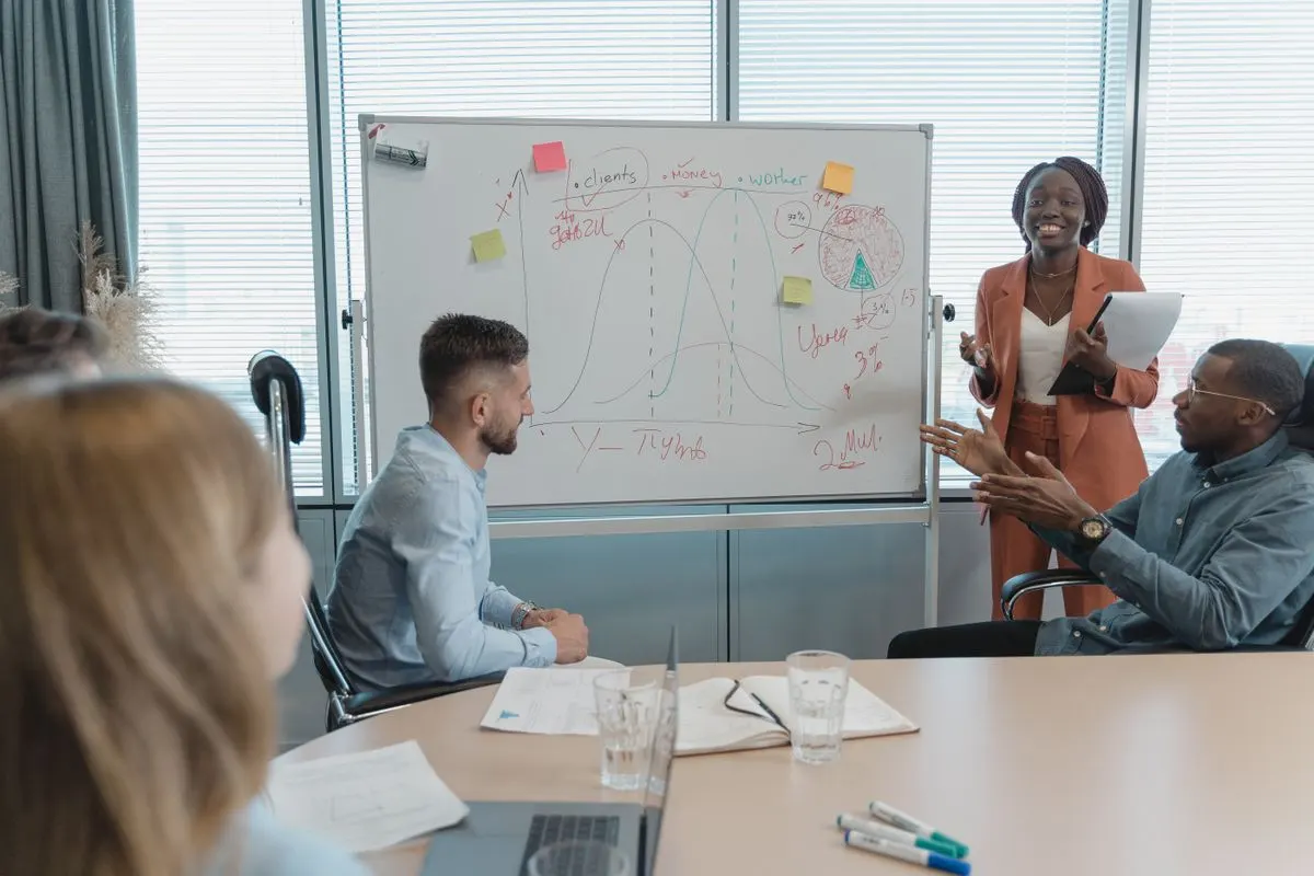 Coworkers in a meeting discussing startup tax exemption eligibility