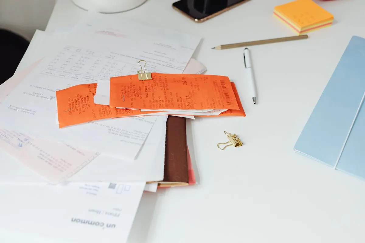Receipts and documents on top of a desk, representing corporate secretarial services fees in Singapore